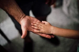 child hand in fathers