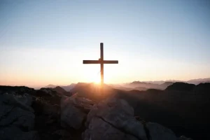 sunlight behind cross